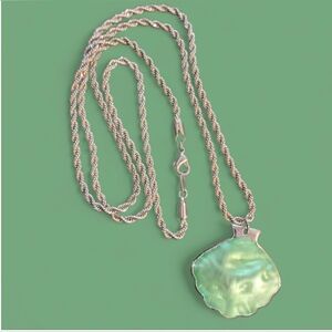 Iridescent Green Shell Pendant with Pearls On Backside Strung on a Rope Chain.